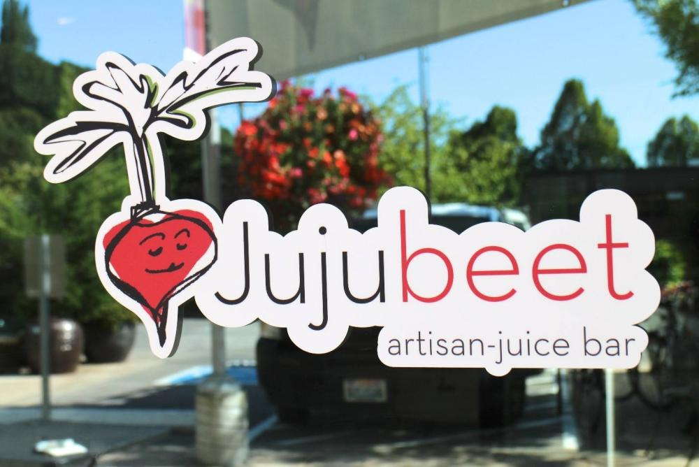 A custom store decal that reads Juju Beat Artisan-juice Bar