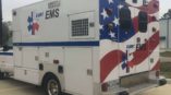Custom vehicle wrap on a EMT vehicle that is outside
