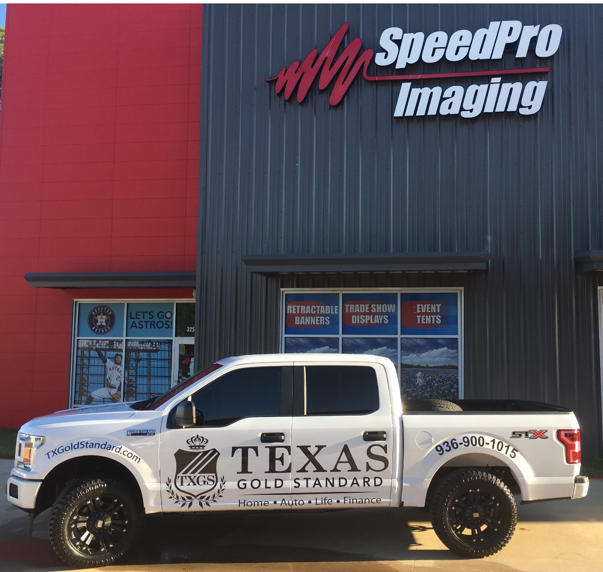 The SpeedPro building with a pick-up truck sitting out front that has a custom vehicle wrap