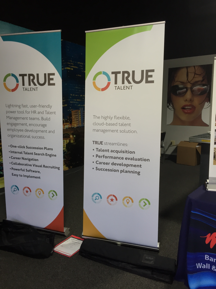 Two banners at a tradeshow for True Talent