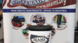 Tradeshow display for the National Association of Seams featuring a podium and screen