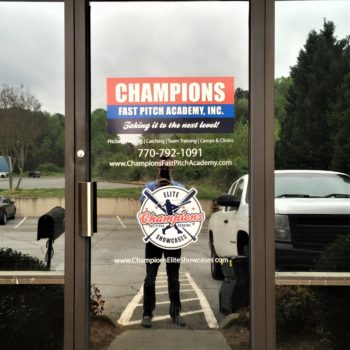 Door decal created for Champions Fast Pitch Academy featuring their logo with two crossed baseball bats 