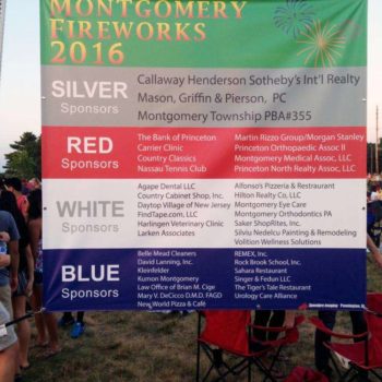 Banner listing the red, blue, silver and white sponsors for the Montgomery Fireworks in 2017