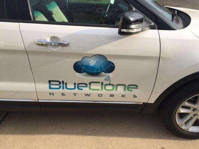 Spot graphics on white SUV for Blue Clone Networks