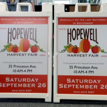 2 outdoor signs for the Hopewell Harvest Fair with 4 pumpkins on each