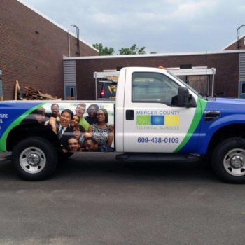 Vehicle wrap on pickup truck for Mercer County Technical Schools with images of students.