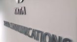 Tata Communications' logo on a blue wall