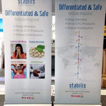 2 banner signs advertising how Stabilis Pharmaceuticals is differentiated and safe.