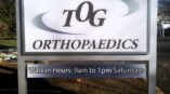 Road sign at driveway entrance to Orthopaedics