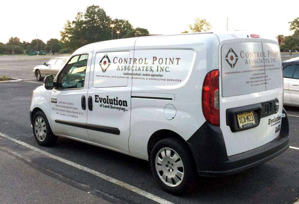 Vehicle lettering on white van for Control Point Associates, Inc.