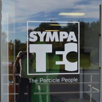 Window graphic at entrance to Sympatec