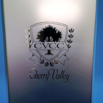 Window graphic with tree on shield for CVCC.
