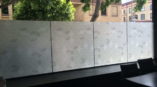 A glass finish featuring different shades of white and grey