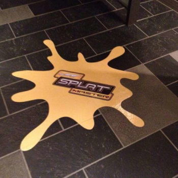 A yellow floor graphic for Splat Master