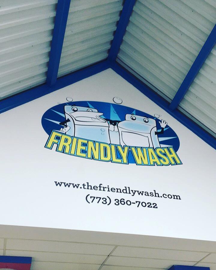 A wall graphic for Friendly Wash with their logo