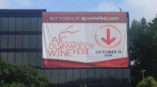 AJC Winefest outdoor banner hanging on a building