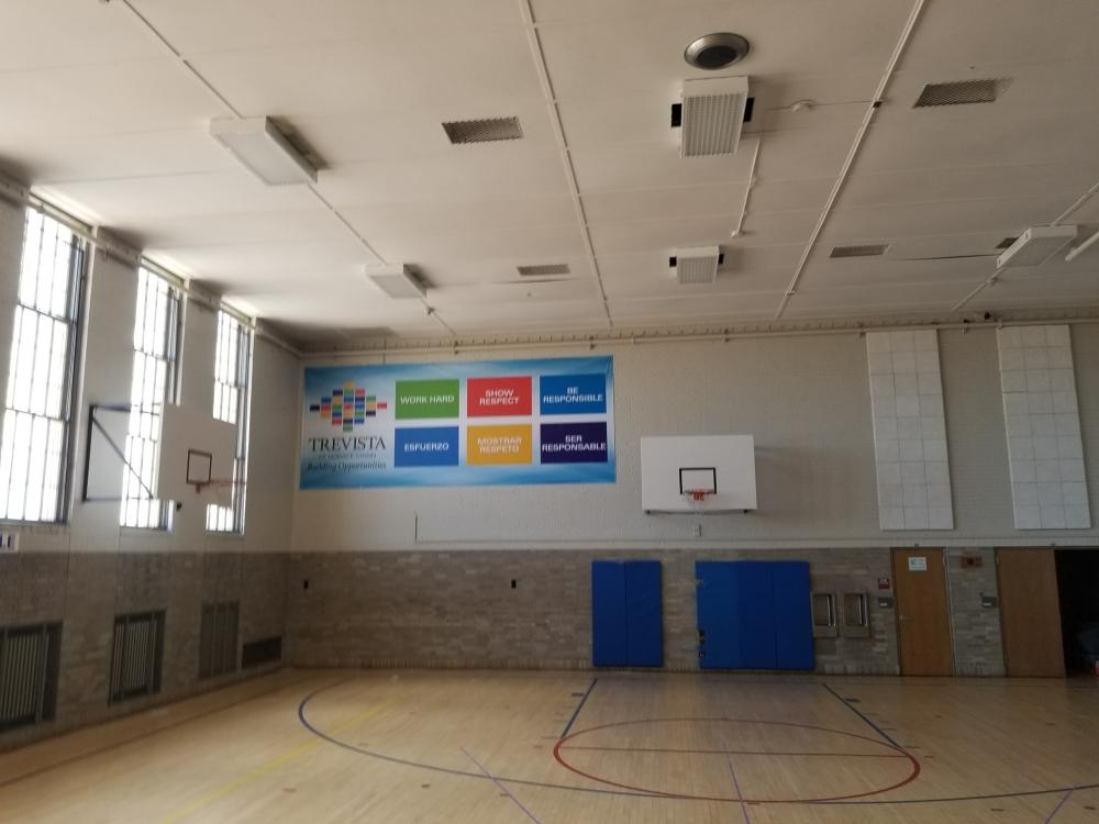 Trevista vinyl banner hanging in basketball court