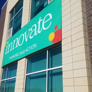 Innovate outdoor hanging vinyl sign