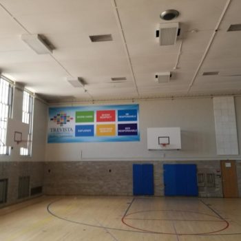 Trevista hanging vinyl sign in basketball court