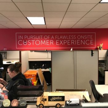 Customer Experience wall graphic in office