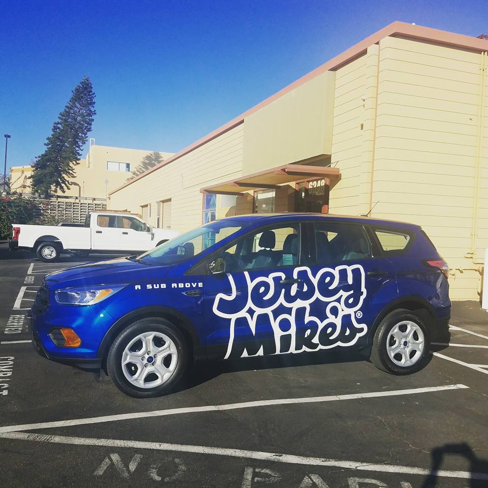 jersey mike's logo car decal on blue SUV