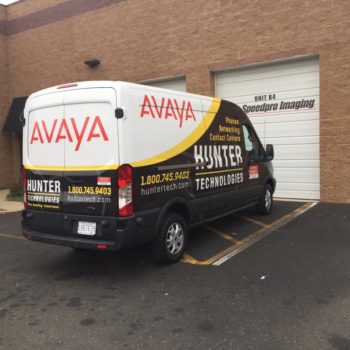 Avaya black, yellow, white van wrap