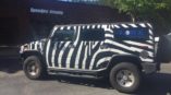 Vehicle wrap for Lowe Engineering featuring a jeep with zebra print 