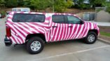 Pink zebra print truck wrap