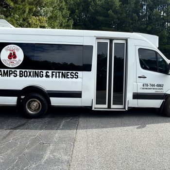 Champs Boxing & Fitness shuttle van wrap and branding