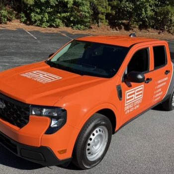 Surface Experts brilliant orange maverick truck wrap