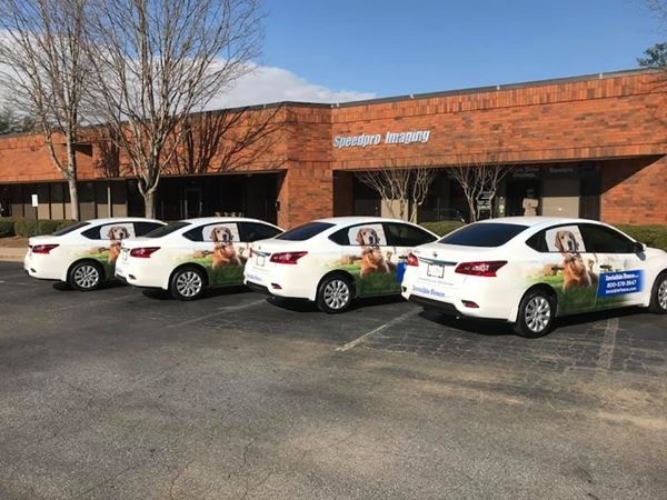 Invisible Fence Fleet Graphics with Custom Graphics and Window Perforated Vinyl