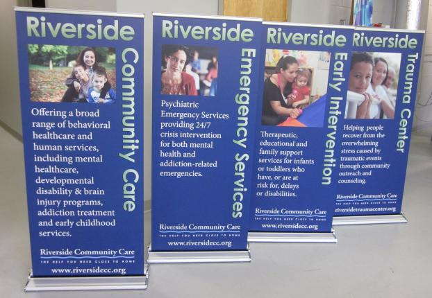 Four custom Standing signs advertising Riverside Community Care. 