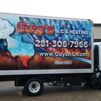 Vehicle wrap for Guy's A/C & Heating with graphic of snowflakes and fire 