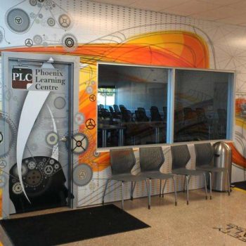 Wall mural for Phoenix Learning Centre featuring graphics of gears
