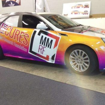 Multicolored vehicle wrap by SpeedPro 