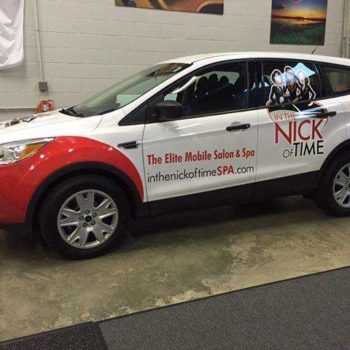 In the Nick of Time white vehicle wrap for van by SpeedPro 