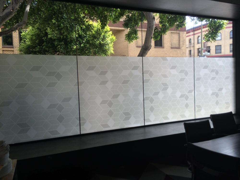 Custom window graphics of grey and white hex blocks. 