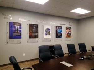 Image of acrylic artwork with dimensional letters, installed in a conference room in Cary, NC.