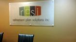 Image of a frosted acrylic sign, installed in a conference room in Cary, NC.
