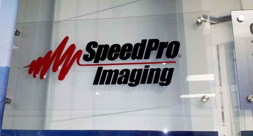 Image of a dimensional logo on an acrylic sign, installed in Morrisville, NC.