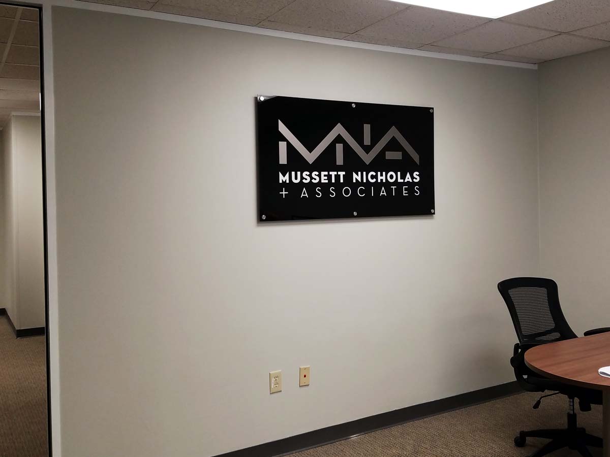Mussett Nicholas + Associates acrylic wall-mounted sign