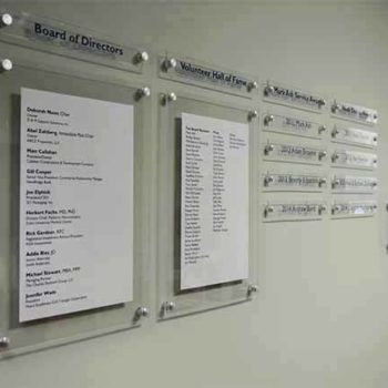 Acrylic wall signs labeling the board of directors and names of volunteers for a business in Morrisville, NC