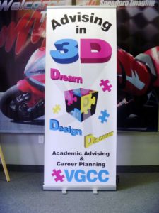 Image of a retractable banner stand for a community college.