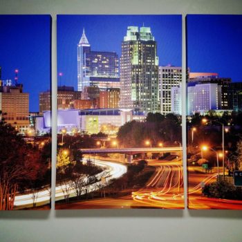 City scene stretched across three canvas panels 