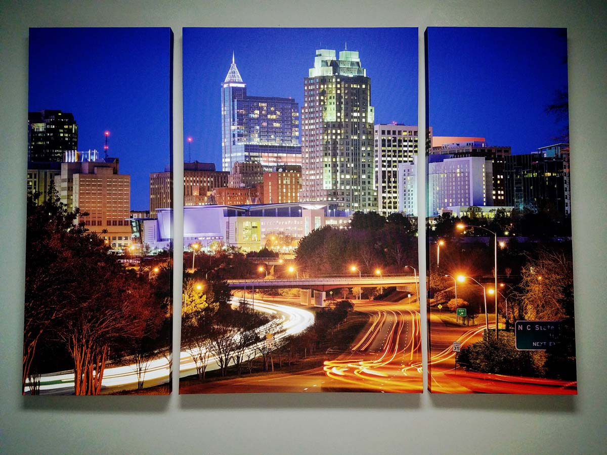 City scene stretched across three canvas panels 