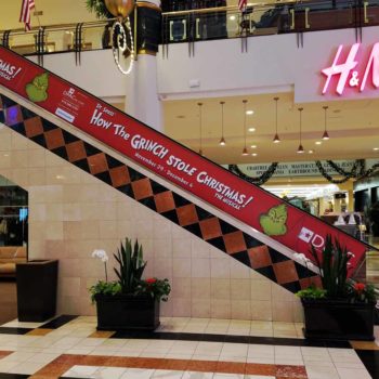 Image of an escalator wrap, installed in a mall in Raleigh, NC.