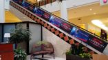 Image of escalator graphics, installed in a mall in Raleigh, NC.