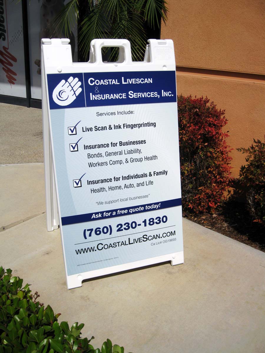 Image of a plastic A-frame sign, displayed outside.