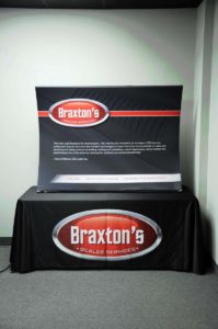 Image of a table top fabric display with a table cloth for a trade show event.