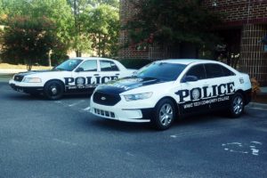 Image of reflective cut vinyl decals, installed on an entire fleet of police cars for Wake Tech.